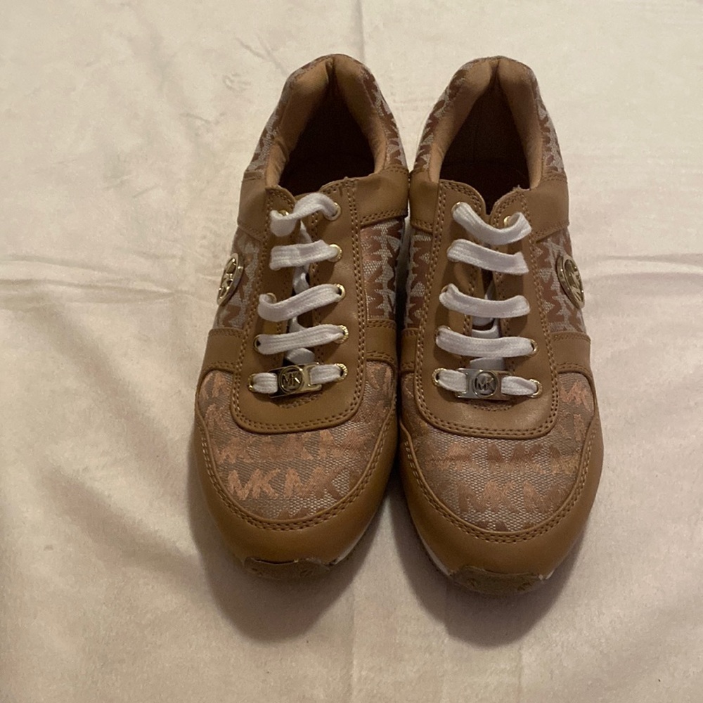 Tan, white and gold Michel Kors tennis shoes. *tween size 4/women’s size 6.5